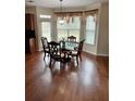 Bright dining area with hardwood floors and a bay window, adjacent to the kitchen at 165 Summit Point Dr, Fayetteville, GA 30214