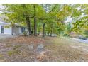 Ranch home with mature trees and a spacious front yard at 6168 Ellis St, Douglasville, GA 30134