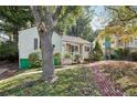 Light green house with a brick walkway and large yard at 1618 Belmont Sw Ave, Atlanta, GA 30310
