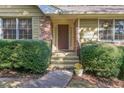 Inviting front entrance with steps leading to a charming front door at 1996 Walton Woods Cir, Tucker, GA 30084