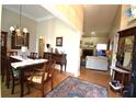 Elegant dining room with hardwood floors and a view into the living room at 1025 Copper Creek Dr, Canton, GA 30114