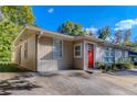 House with red door and carport at 2308 Sheryl Dr, Decatur, GA 30032