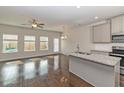 Open concept kitchen with granite countertops and stainless steel appliances at 7121 Gladstone Cir, Lithonia, GA 30038