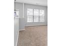 Spacious living room with large windows at 3034 Liberty Nw Way, Atlanta, GA 30318