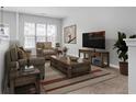 Bright living room with comfy furniture and TV at 3034 Liberty Nw Way, Atlanta, GA 30318