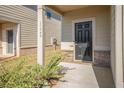 Front door entry with black door and brick accents at 11948 Brightside Pkwy, Hampton, GA 30228