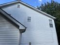 Side view of a house with white vinyl siding at 3423 Homeward Trl, Ellenwood, GA 30294