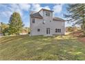 Rear view of two story home showcasing large backyard at 5401 Stone Cove Sw Dr, Atlanta, GA 30331