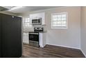 Updated kitchen with stainless steel appliances and granite countertops at 6230 Kensington Ct, Austell, GA 30106