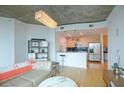 Open kitchen with granite countertops and stainless steel appliances at 400 W Peachtree Nw St # 1713, Atlanta, GA 30308