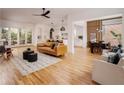 Open-concept living room with hardwood floors and modern furniture at 1281 Avalon Ne Pl, Atlanta, GA 30306
