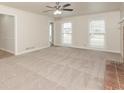 Spacious living room featuring neutral carpeting at 1851 Furlong Run, Lawrenceville, GA 30043
