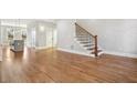 Spacious living room with hardwood floors and staircase at 106 Hogue St, Atlanta, GA 30312