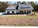 Newly constructed home featuring a front porch and landscaped yard at 133 Goldin Rd, Temple, GA 30179