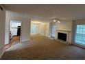 Open concept living and dining area with kitchen access at 1101 Lenox Ne Way # 1101, Atlanta, GA 30324