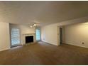 Spacious living room with fireplace and carpet at 1101 Lenox Ne Way # 1101, Atlanta, GA 30324