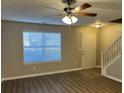 Living room featuring hardwood floors and staircase at 3228 Diamond Blf, Union City, GA 30291