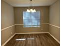 Bright dining room with hardwood floors and chandelier at 3228 Diamond Blf, Union City, GA 30291