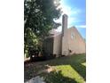 Rear view of home with deck and surrounding trees at 533 Riverbirch Trce, Stone Mountain, GA 30087