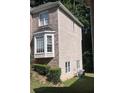 Side view of home showcasing brick and siding at 533 Riverbirch Trce, Stone Mountain, GA 30087