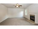 Living room with fireplace and neutral carpeting at 4815 Plainsman Cir, Cumming, GA 30028