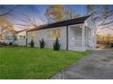 Charming white brick ranch home with a spacious lawn and modern front porch at 1246 Lyle Ave, East Point, GA 30344