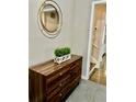 Bright entryway with a dresser, mirror, and plant adding a touch of elegance at 2501 Henderson Mill Ne Rd, Atlanta, GA 30345