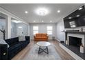Spacious living room with hardwood floors and a fireplace at 1368 New Hope Rd, Lawrenceville, GA 30045