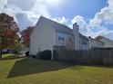 Back of house with fenced yard at 2334 Pierce Way, Buford, GA 30519