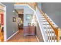 Bright entryway with hardwood floors, staircase, and charming decor at 3559 Gus Way, Powder Springs, GA 30127