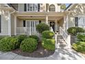 Two-story house with stone accents and a charming front porch at 1400 Lamont Cir, Dacula, GA 30019