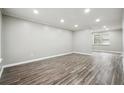 Spacious living room with gray walls and wood-look floors at 5271 Kelleys Mill Cir, Stone Mountain, GA 30088
