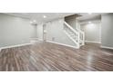 Bright living room with hardwood floors and neutral walls at 5271 Kelleys Mill Cir, Stone Mountain, GA 30088