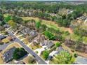 Aerial view showcasing the house's location in a neighborhood at 8120 Turnberry Way, Duluth, GA 30097