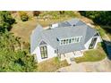 Modern home with a gray roof and white exterior, viewed from above at 1870 Chartwell Trce, Stone Mountain, GA 30087