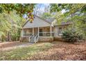 Front view of a house with a porch and walkway at 175 Carriage Gate Dr, Sharpsburg, GA 30277