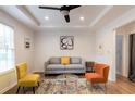 Bright living room with gray sofa, accent chairs, and a coffee table at 3198 Oakdale Rd, Atlanta, GA 30354