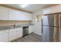 Modern kitchen with stainless steel appliances and granite countertops at 2465 Timberly Se Dr, Marietta, GA 30060