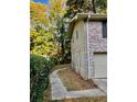 Side view showing walkway and exterior wall at 1120 Buckhurst Dr, Atlanta, GA 30349