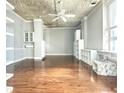 Spacious living room with hardwood floors and built-in shelving at 20 Marietta Nw St # 17F, Atlanta, GA 30303