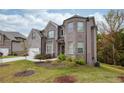 Two-story house with brick and siding, offering curb appeal at 4203 Shandi Cv, Hoschton, GA 30548