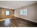 Living room with hardwood floors and neutral walls at 1938 Lomita Se Rd, Atlanta, GA 30316