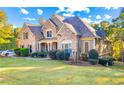 Large two-story house with brick and siding exterior at 145 Oak Forest Dr, Oxford, GA 30054