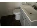 Small bathroom with a single vanity and dark tile flooring at 3230 Vanderbilt Nw Ln, Atlanta, GA 30318