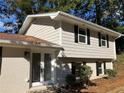 Newly painted house with white front door and landscaping at 3666 Elkridge Dr, Decatur, GA 30032