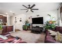 Spacious living room with leather sofas, large TV, and ample natural light at 532 Ruths Dr, Woodstock, GA 30188