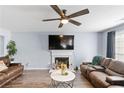 Living room with fireplace and hardwood floors at 5885 Raventree Ct, South Fulton, GA 30349