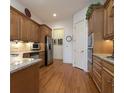 Kitchen with granite countertops and stainless steel appliances at 5823 Sarazen Trl, Douglasville, GA 30135