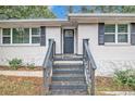 Front entry with steps and black railing at 1376 David Cir, Decatur, GA 30032