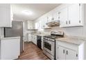 Bright kitchen featuring stainless steel appliances and granite countertops at 6275 S Skyline Dr, Douglasville, GA 30135